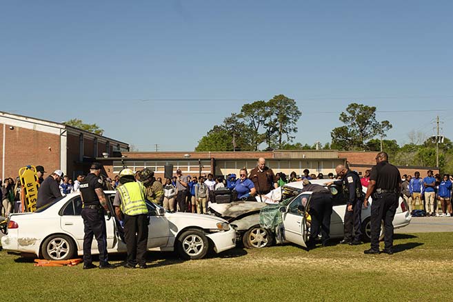 ECHS students watch as emergency personnel ‘work’ the accident scene.